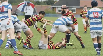  ??  ?? Sunderland hooker Peter Harrison (eith headband) tries to stop North Shields.