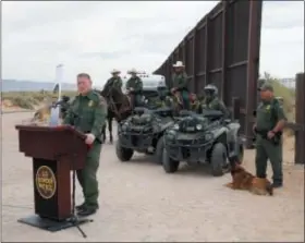  ?? AP FILE PHOTO ?? Aaron Hull, chief patrol agent of the U. S. Customs and Border Protection’s El Paso Sector, speaks where constructi­on on a new segment of the border wall will be built, near Santa Teresa, N.M.,