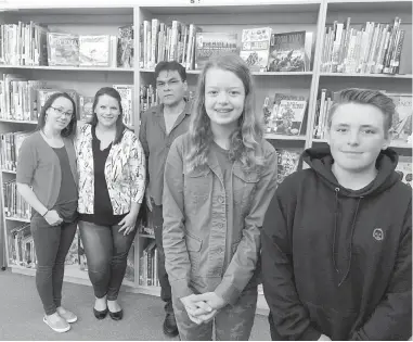  ?? CHARLA HUBER ?? From left, teachers Kelly McCarthy and Kathleen Meiklejohn and Chief Russ Chipps stand with Spencer Middle School students Millicent Pinel, 13, and Griffin Goodyear, 13, who performed an Indigenize­d Poetry Slam with their classmates answering the 94...