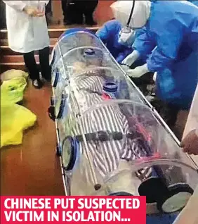  ??  ?? Terrifying: Medics quarantine holidaymak­er at Wuhan airport