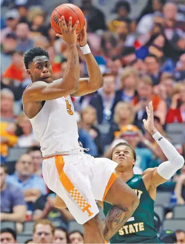  ?? THE ASSOCIATE PRESS ?? Tennessee forward Admiral Schofield looks to make a pass as Wright State forward Everett Winchester defends in their NCAA tournament opener Thursday in Dallas. The third-seeded Vols face 11th-seeded Loyola-Chicago tonight.