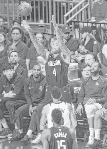  ?? Mark Mulligan / Houston Chronicle ?? All eyes are on Rockets forward P.J. Tucker has he launches a 3-pointer seemingly from the bench during Game 5 on Wednesday. Tucker was 5-for-7 from long range as the Rockets went 18-for-44 in the 122-104 win.