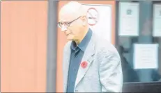  ?? TERRENCE MCEACHERN/THE GUARDIAN ?? Roger James Jabbour leaves provincial court in Charlottet­own on Friday after Chief Judge Nancy Orr acquitted him on two counts of sexual exploitati­on.