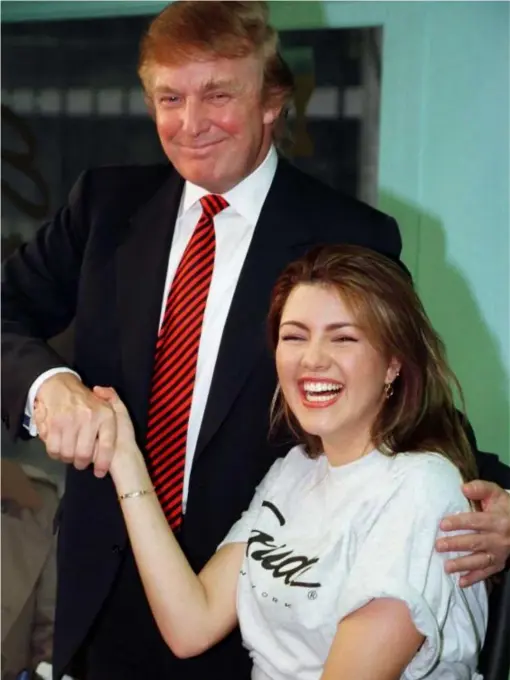  ?? (Reuters) ?? Ms Machado with Mr Trump during a staged workout at a gym in New York in 1997
