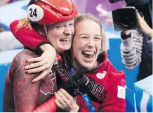  ?? PAUL CHIASSON/THE CANADIAN PRESS ?? Kim Boutin, left, celebrates her bronze in women’s 500-metre short track with Marianne St-Gelais.