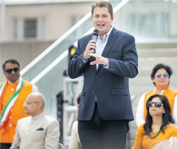  ?? ERNEST DOROSZUK / POSTMEDIA NEWS ?? Conservati­ve Leader Andrew Scheer addresses the crowd at the start of India Day Festival and Grand Parade in Toronto on Sunday.
