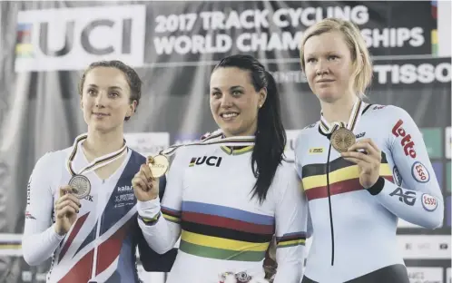  ??  ?? 0 Britain’s Elinor Barker, left, on the podium with winner Rachele Barbieri of Italy, centre, and bronze medallist Jolien D’hoore of Belgium.