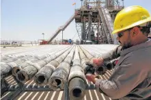  ?? REUTERS ?? A man working at Rumaila oilfield in Basra, Iraq, 2017.