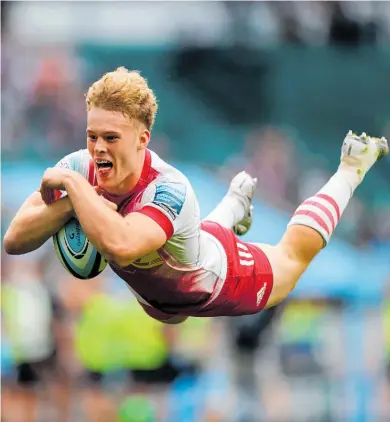  ??  ?? Winger Louis Lynagh scores the first of his two tries for Harlequins in last year’s Premiershi­p final against Exeter at Twickenham in July.