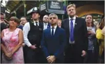  ?? — AFP ?? LONDON: Mayor of London Sadiq Khan (center) attends the re-opening of Borough Market yesterday in central London following the June 3 terror attack.