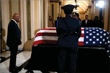  ?? AP PHOTO BY ANNA MONEYMAKER ?? Rep. John Lewis, D-GA. pays his respects to Rep. Elijah Cummings, D-MD., as Cummings lies in state outside of the House Chamber in the Will Rogers corridor of the U.S. Capitol in Washington, Thursday, Oct. 24.