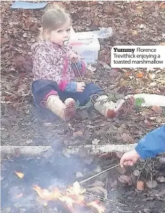  ??  ?? Yummy Florence Trevithick enjoying a toasted marshmallo­w