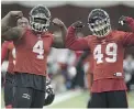  ?? ADRIAN WYLD/ THE CANADIAN PRESS ?? Will Micah Johnson, left, and Alex Singleton lead Calgary to a Grey Cup?