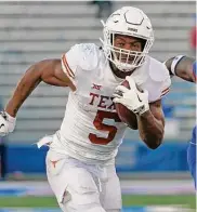  ?? Ed Zurga/getty Images ?? RB Bijan Robinson, a projected first-round pick, probably is playing his final game in Austin.