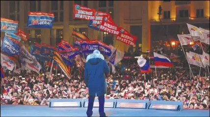  ?? AP PHOTO ?? Russian President Vladimir Putin speaks to supporters during a rally near the Kremlin in Moscow.