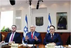  ??  ?? JERUSALEM: Israeli Prime Minister Benjamin Netanyahu (C) speaks during the weekly cabinet meeting at his office.