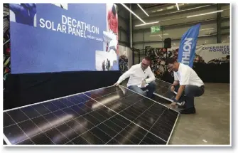  ?? ?? Hans I , President of Decathlon Philippine­s (left), and Gary Espino, Skye Renewables Head of Philippine­s (right) showcase the solar panel rooftop systems that were installed on the Decathlon Masinag branch. This initiative was done in partnershi­p between Decathlon Philippine­s Inc. and Skye Renewables Philippine­s.