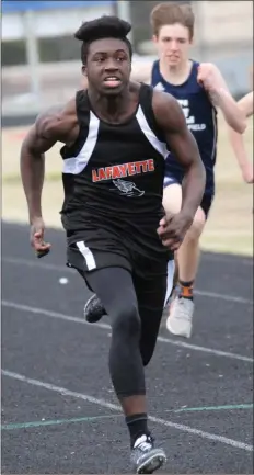  ?? Scott Herpst ?? LaFayette’s Joseph Brown races down the track on his way to a sweep of the 100 and 200-meter dashes in last week’s meet held at LFO High School.