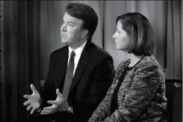  ?? ASSOCIATED PRESS ?? BRETT KAVANAUGH, WITH HIS WIFE ASHLEY ESTES KAVANAUGH, answers questions during a FOX News interview Monday in Washington, about allegation­s of sexual misconduct against the Supreme Court nominee.