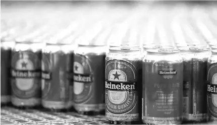  ?? — Reuters photo ?? Heineken sells its premium lagers Heineken, Tiger and Sol in China, along with cheaper local brands Anchor and Hainan Beer.