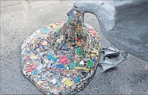  ?? GREENPEACE/SUBMITTED PHOTO ?? A part of “Plasticide,” a sculpture by Jason deCaires Taylor, shows a seagull vomiting plastic pieces. The sculpture as a whole, located in London, is meant to draw attention to ocean plastics.