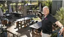  ??  ?? Geoff Murphy shows off the outdoor seating.