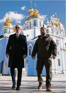  ?? Evan Vucci/AFP/Tribune News Service ?? President Joe Biden joins Ukrainian President Volodymyr Zelenskyy for a visit to St. Michael’s monastery in Kyiv.