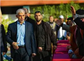  ?? SAMAR ABU ELOUF/NEW YORK TIMES ?? Yehya Sinwar, head leader of Hamas, greeted audiences at the Internatio­nal Quds Day Festival in Gaza City on April 14.