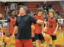  ?? STACI VANDAGRIFF/THREE RIVERS EDITION ?? New Searcy Lions basketball coach Wayne Herren gives instructio­ns to his team during a recent practice. Also pictured are Braden Watson, No. 10; Owenn Marino, No. 15; and Ethan Elsberry, No. 14.