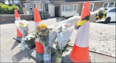  ??  ?? ■ Flowers left at the scene of the accident in Ashby Road Loughborou­gh. Photo Leicester Mercury