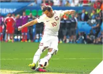  ??  ?? ■ Poland’s Grzegorz Krychowiak scores at the penalty shoot-out to win the game.