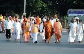  ?? ?? Monks arrive to watch The Kashmir Files movie, in Surat on Wednesday. ANI