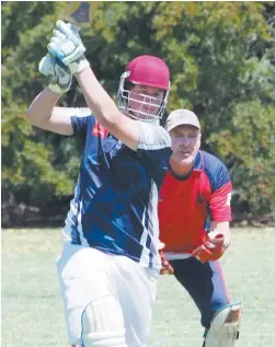  ??  ?? Above: Neerim District’s Heath Darcy hits out during the division four match against Buln Buln; Photograph: Paul Cohen