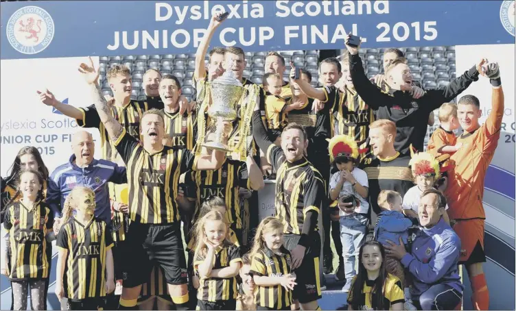  ?? Picture: SNS ?? A jubilant Auchinleck side celebrate their 2-1 victory over Musselburg­h Athletic in the Scottish Junior Cup final at Kilmarnock’s Rugby Park. It’s the 11th time the Ayrshire club have won the trophy