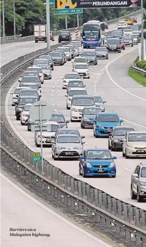  ??  ?? Barriers on a Malaysian highway.