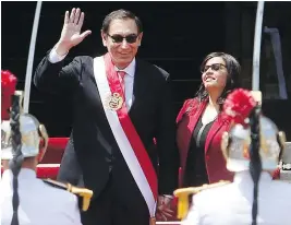  ?? KAREL NAVARRO, THE ASSOCIATED PRESS ?? Accompanie­d by his wife, first lady Maribel Diaz, Peruvian President Martin Vizcarra arrives Friday at the House of Pizarro, the presidenti­al residence and workplace in Lima.