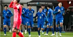  ?? Photo: AFP ?? Thai players celebrate their goal in the 1-1 draw against South Korea in Seoul on Mar 21.