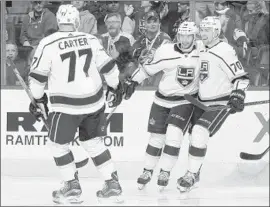  ?? Michael Martin NHLI via Getty Images ?? TOBIAS RIEDER, center, celebrates one of his two goals at Colorado with Jeff Carter and Tanner Pearson. It was a breakout game for the new Kings forward.