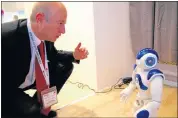  ?? Picture: ZHANG JIEXIAN / PEOPLE’S DAILY ONLINE ?? A visitor interacts with a dancing robot with Huawei Smart Home solution at AfricaCom in Cape Town.