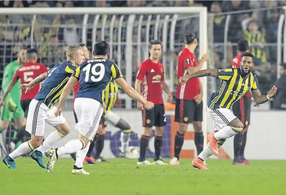  ??  ?? Fenerbahce’s Jeremain Lens wheels away to celebrate after firing the Turkish side into a two-goal lead in the Europa League.