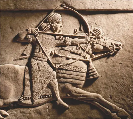  ??  ?? King of the world, king of Assyria: in an astonishin­gly well-preserved relief, the scholar Ashurbanip­al takes part in a royal lion hunt