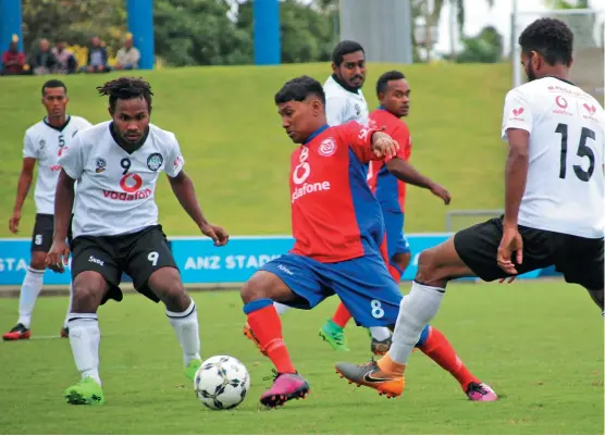  ?? Photo: Fiji FA Media ?? Navua’s Dorsant Naidu tries to work through a gap as Suva’s Patrick Taroga and Jonetani Buksh close in during the Vodafone Premier League clash at the ANZ Stadium, Suva, on September 20, 2020.