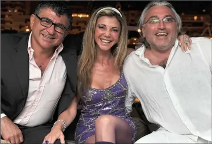  ??  ?? Playboy lifestyle: Property tycoon Vincent Tchenguiz, left, with sister Lisa and brother Robert