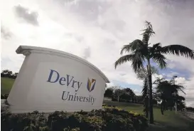  ?? J PAT CARTER/ASSOCIATED PRESS ARCHIVES ?? DeVry University is one of the nation’s for-profit college chains that is scaling back. Since 2014, DeVry has closed 39 campuses and plans to shutter more in the upcoming year.