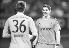  ??  ?? Arsenal goalkeeper Emiliano Martinez (R) reacts during the penalty shootout during the Internatio­nal Champions Cup football match between Bayern Munich and Arsenal in Shanghai July 19, 2017.