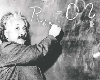  ?? THE ASSOCIATED PRESS FILES ?? Albert Einstein writes out an equation for the density of the Milky Way in 1931. Einstein achieved world renown in 1905, at age 26, when he expounded a theory of general relativity. Jane Macdougall finds a lot of her Einstein moments come to her in the middle of the night.