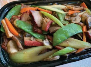  ?? (Arkansas Democrat-Gazette/Eric E. Harrison) ?? We ordered Roast Pork with Mushrooms off the menu at Asia Buffet in the Market Place Shopping Center on Little Rock’s Rodney Parham Road.