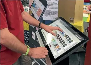  ?? DANIELLE BALMER/SUPPLIED ?? Library technology leader Warrick Taylor using the new Cloud Library Discovery terminal at Manawatu¯ District Libraries.