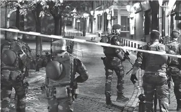  ?? ASSOCIATED PRESS ?? Belgian Army soldiers patrol near Central Station in Brussels after a reported explosion on June 20.