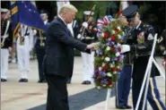  ?? EVAN VUCCI — ASSOCIATED PRESS ?? President Donald Trump lays a wreath during a Memorial Day ceremony at Arlington National Cemetery in Arlington, Va., on Monday.
